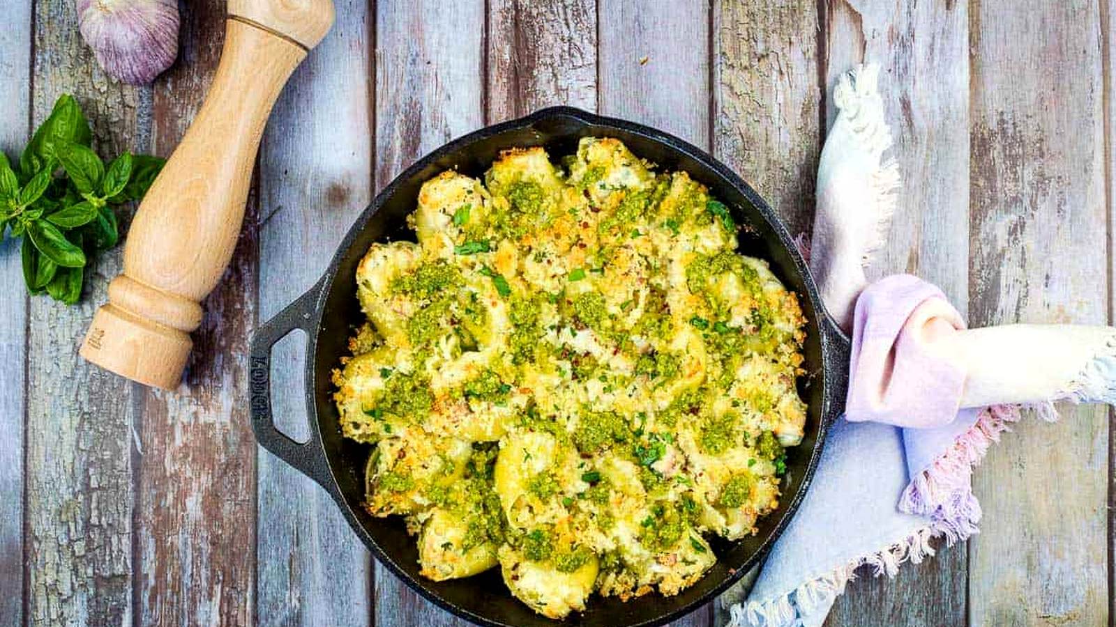 Turkey and Pesto Stuffed Pasta Shells in a black cast iron dish.