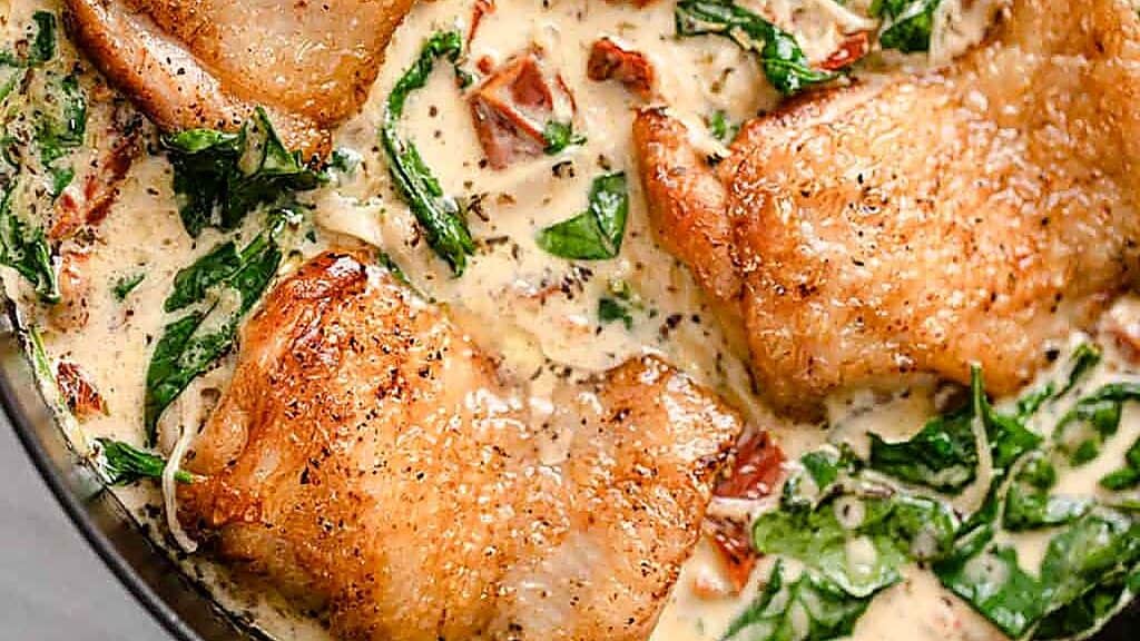 Pan-seared chicken thighs in a creamy sauce with spinach and sun-dried tomatoes, garnished with spices. This dish is easy to customize with ingredient substitutions, allowing you to tailor the flavors to your preference or dietary needs.