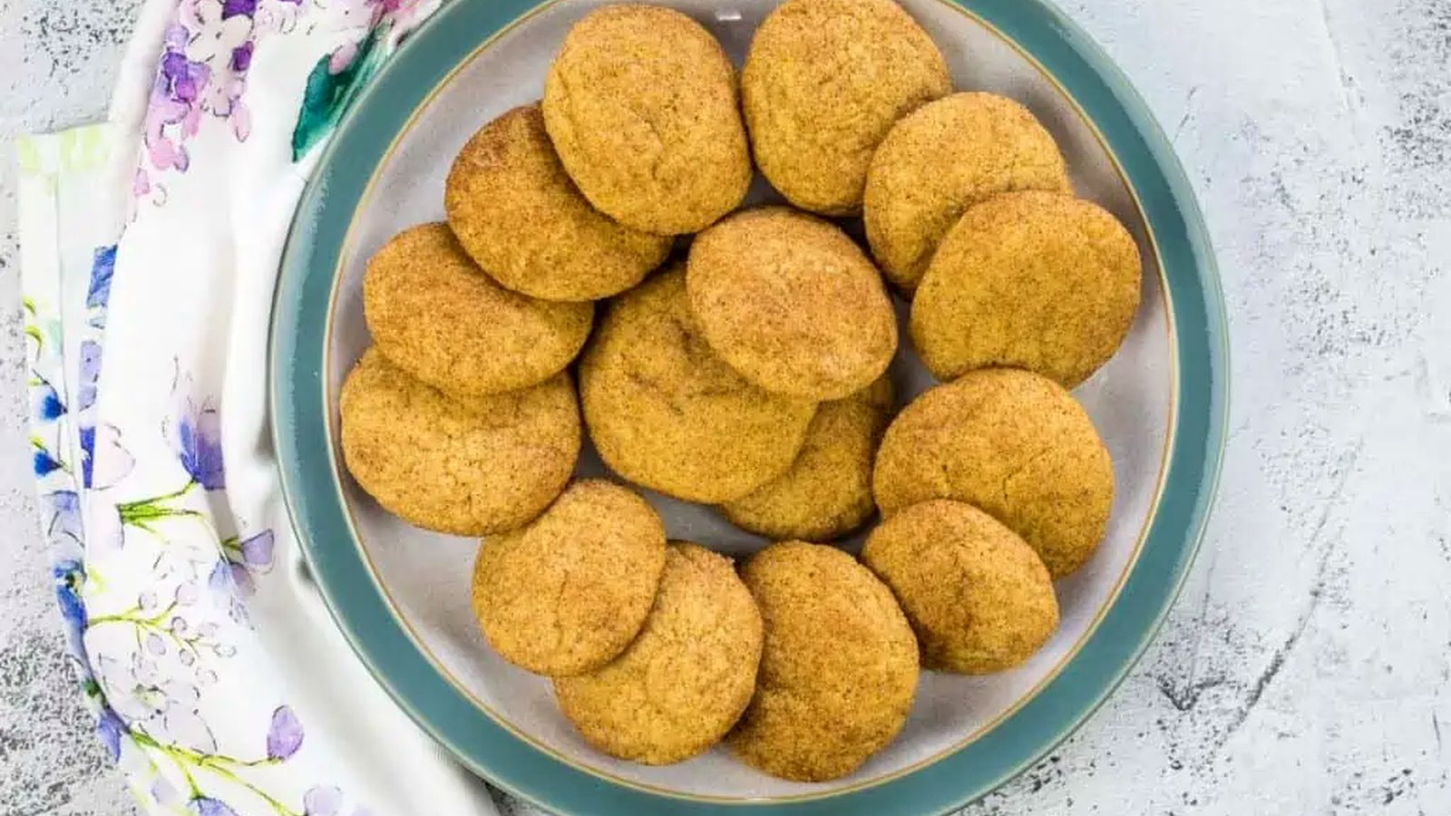 Pumpkin Snickerdoodles on a circle grey and blue plate.