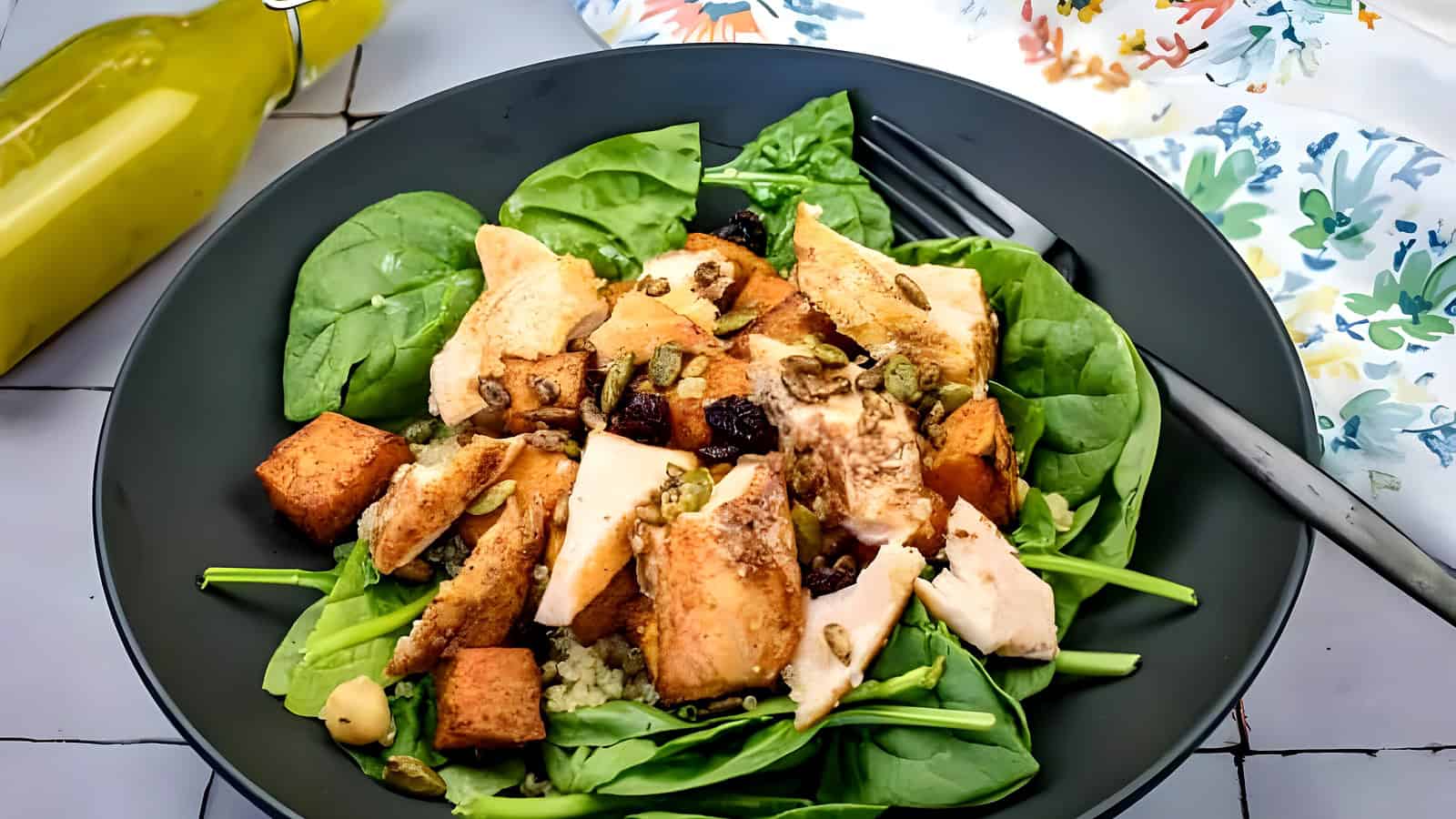 Salmon bowl on a black plate.