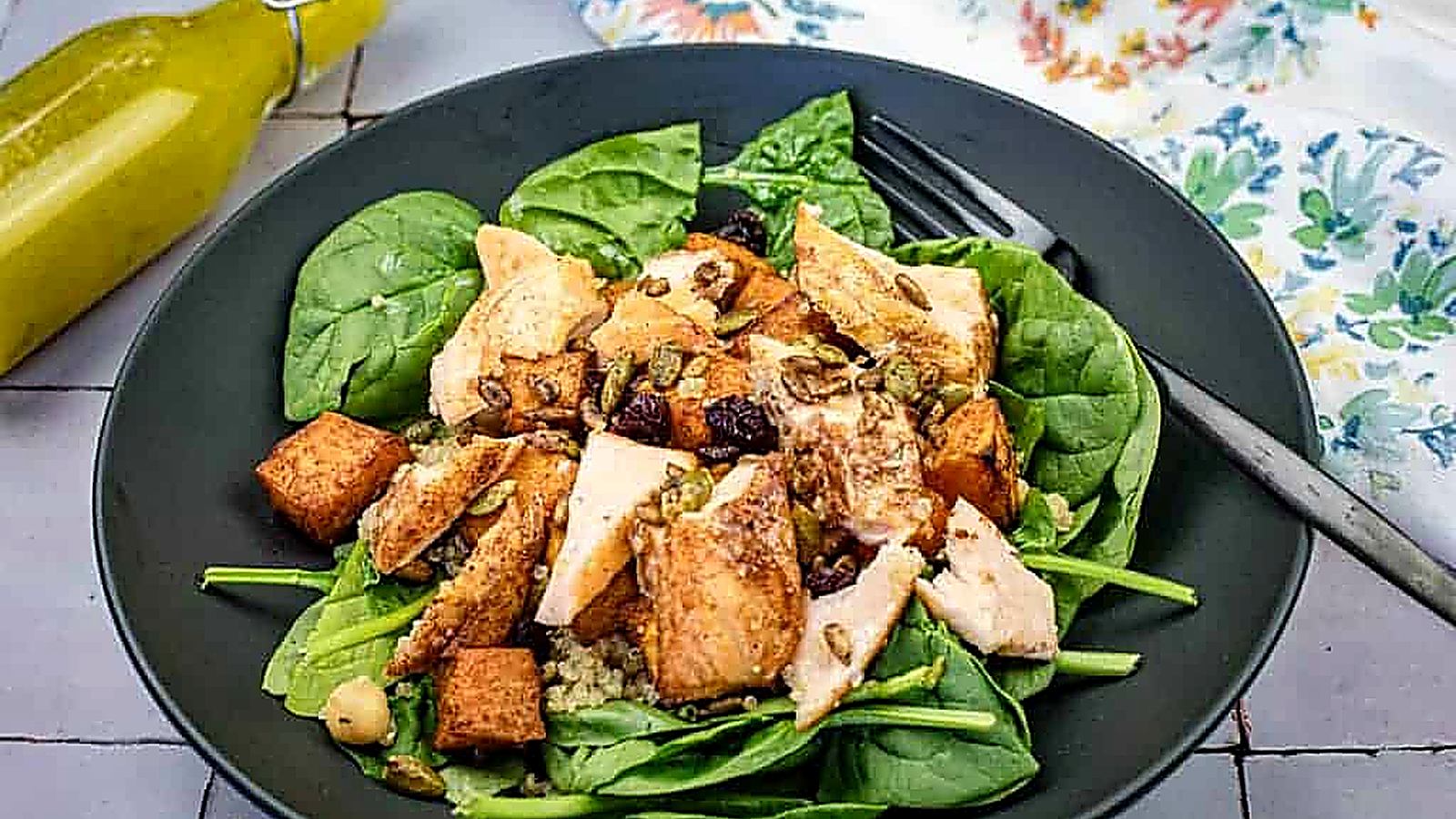 Salmon bowl on a black plate.