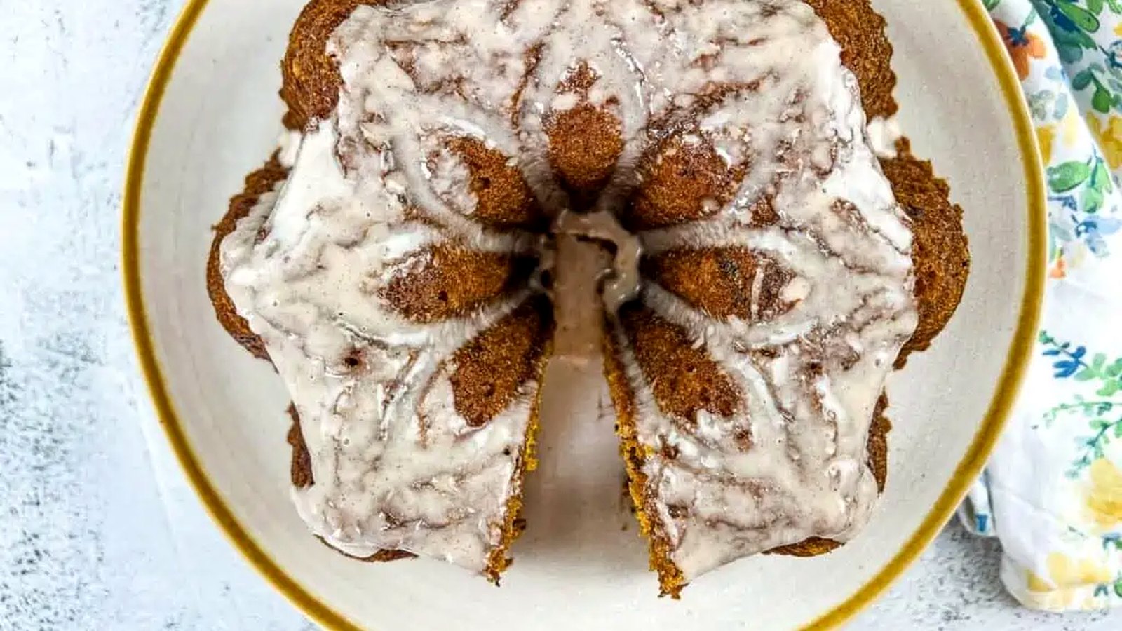 Pumpkin Chocolate Cake on a white circular plate with gold rim.
