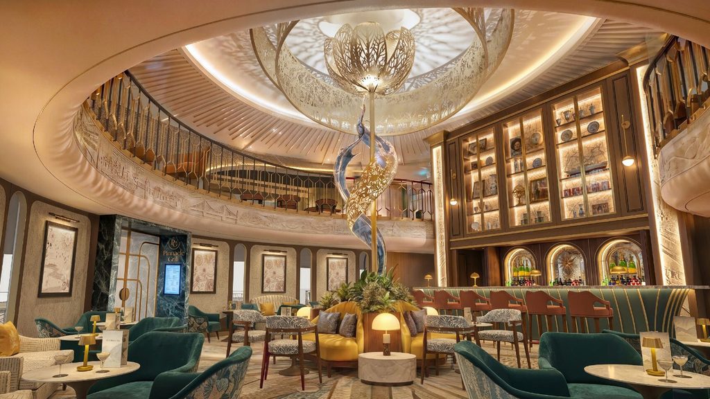 A multi-level lounge featuring a central metallic flower sculpture, a curved yellow sofa, teal velvet chairs, and a Bar 1873 with illuminated glass cabinets.
