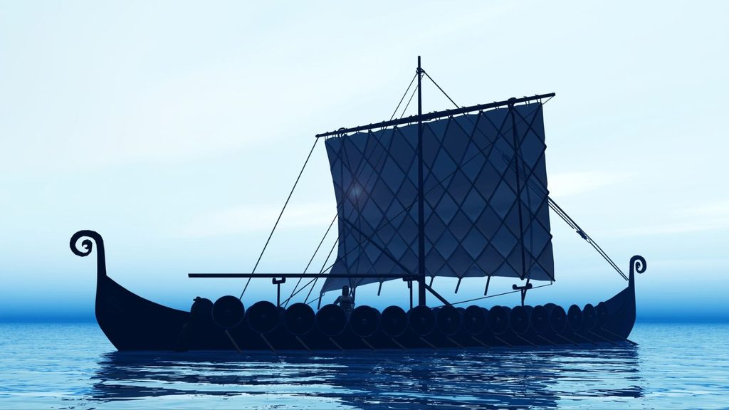 Silhouette of a Viking ship with a square sail on calm water.