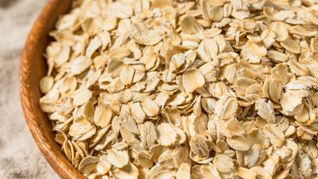 Rolled oats in a wooden bowl.