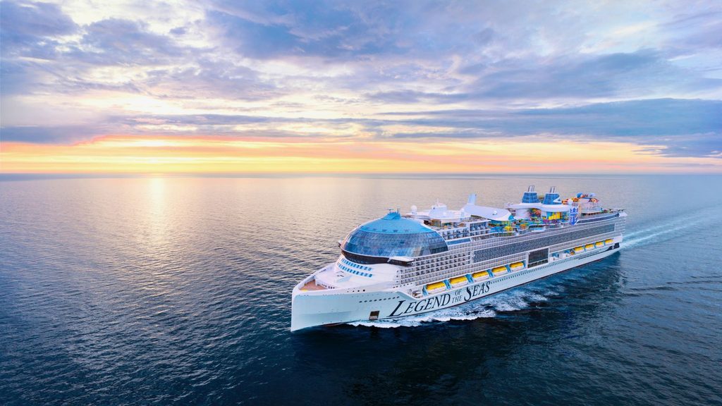 The cruise ship Legend of the Seas sailing on the ocean at sunset.
