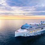 The cruise ship Legend of the Seas sailing on the ocean at sunset.