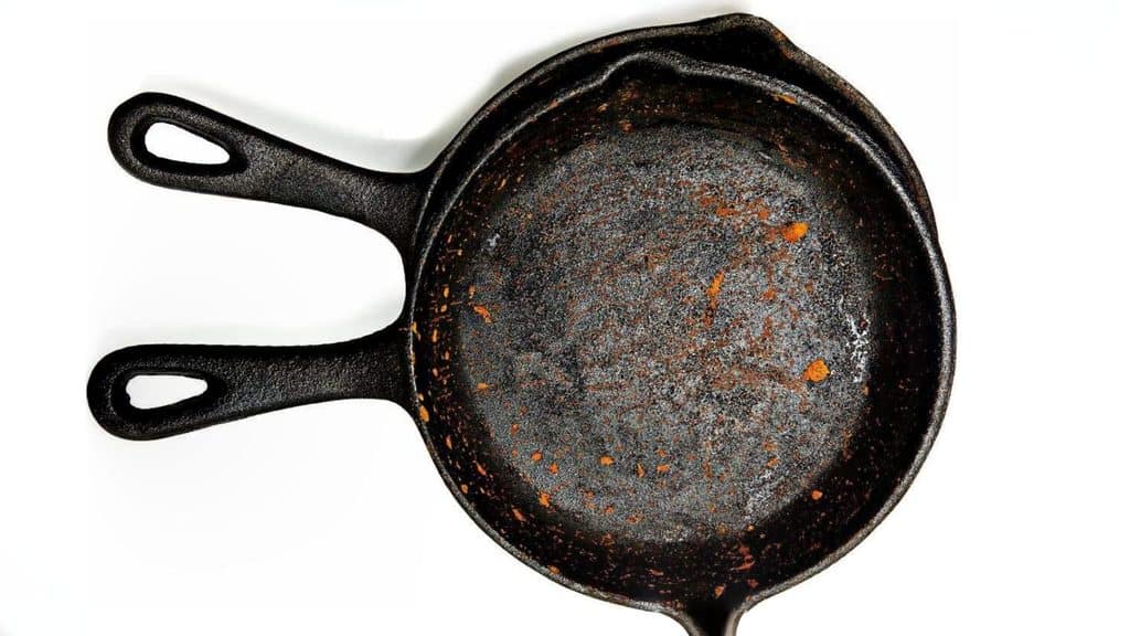 A rusted cast-iron skillet seen from above.