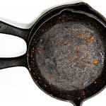 A rusted cast-iron skillet seen from above.