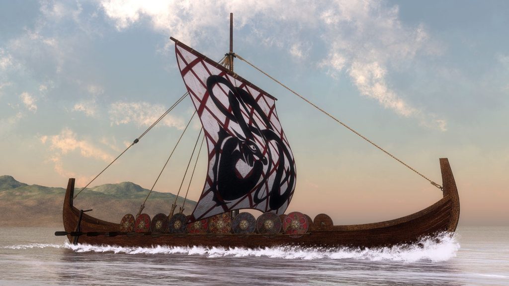 A Viking longship like those sailed on National Leif Erikson Day, featuring a black creature on its sail and shields lining its hull as it travels across the water.